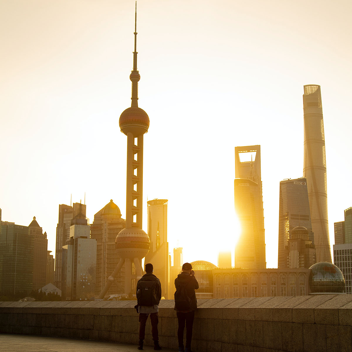 Two men looking out onto Shanghai landscape